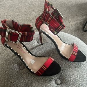Betsy Johnson red plaid heels with rhinestone buckle and zip up back closure.